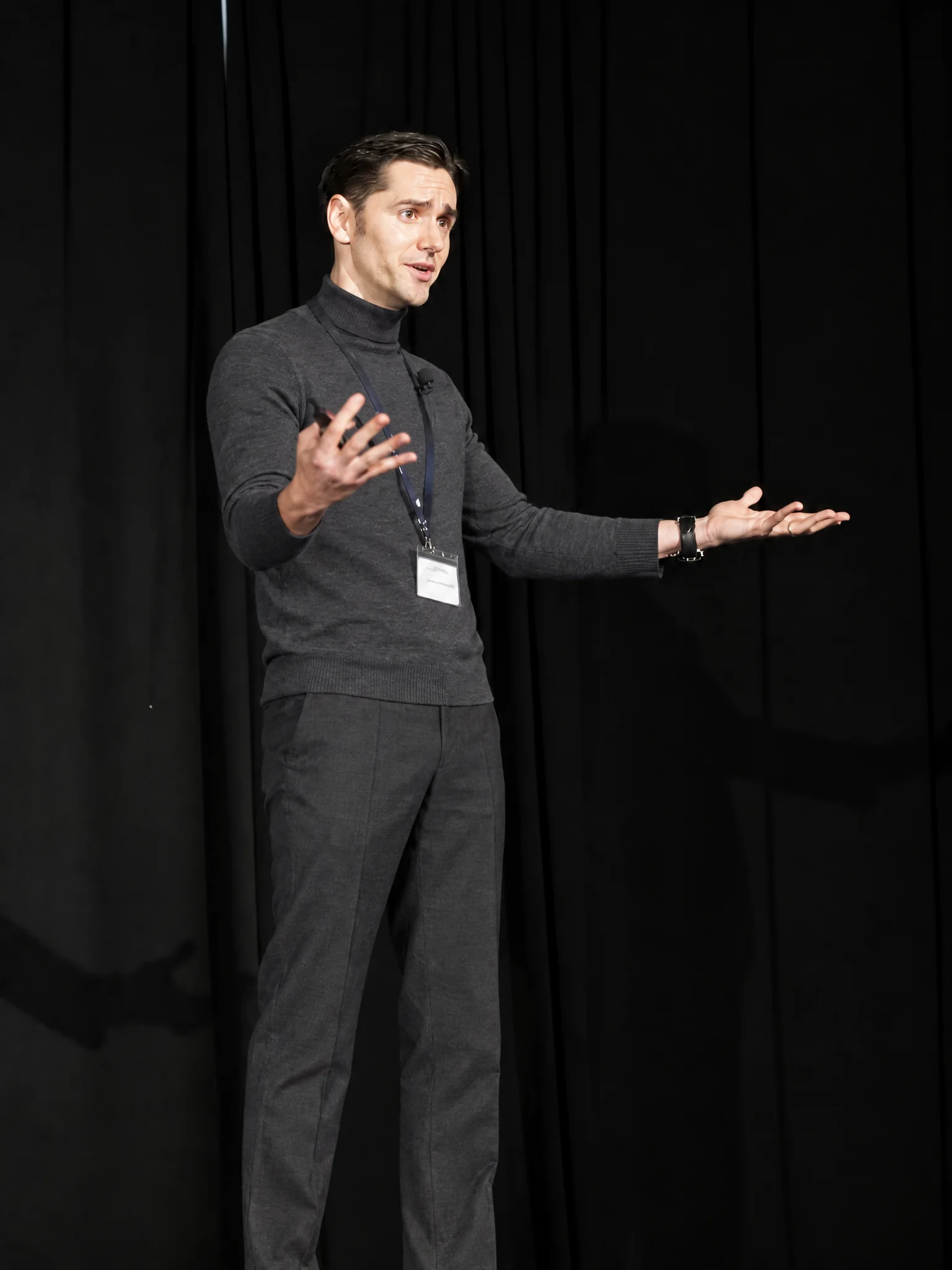 Speaker gesturing during a presentation on stage